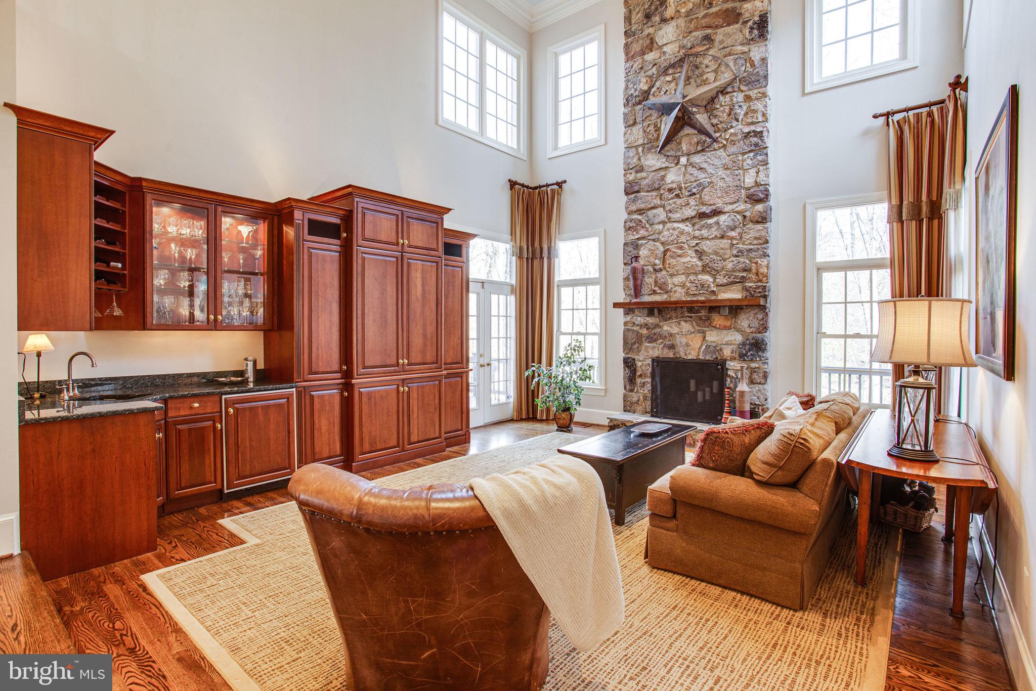 11622 Rolling Meadow Drive Great Falls, VA 22066 - Photo 11 of 45 Stacked stone fireplace & built-ins w/wet bar