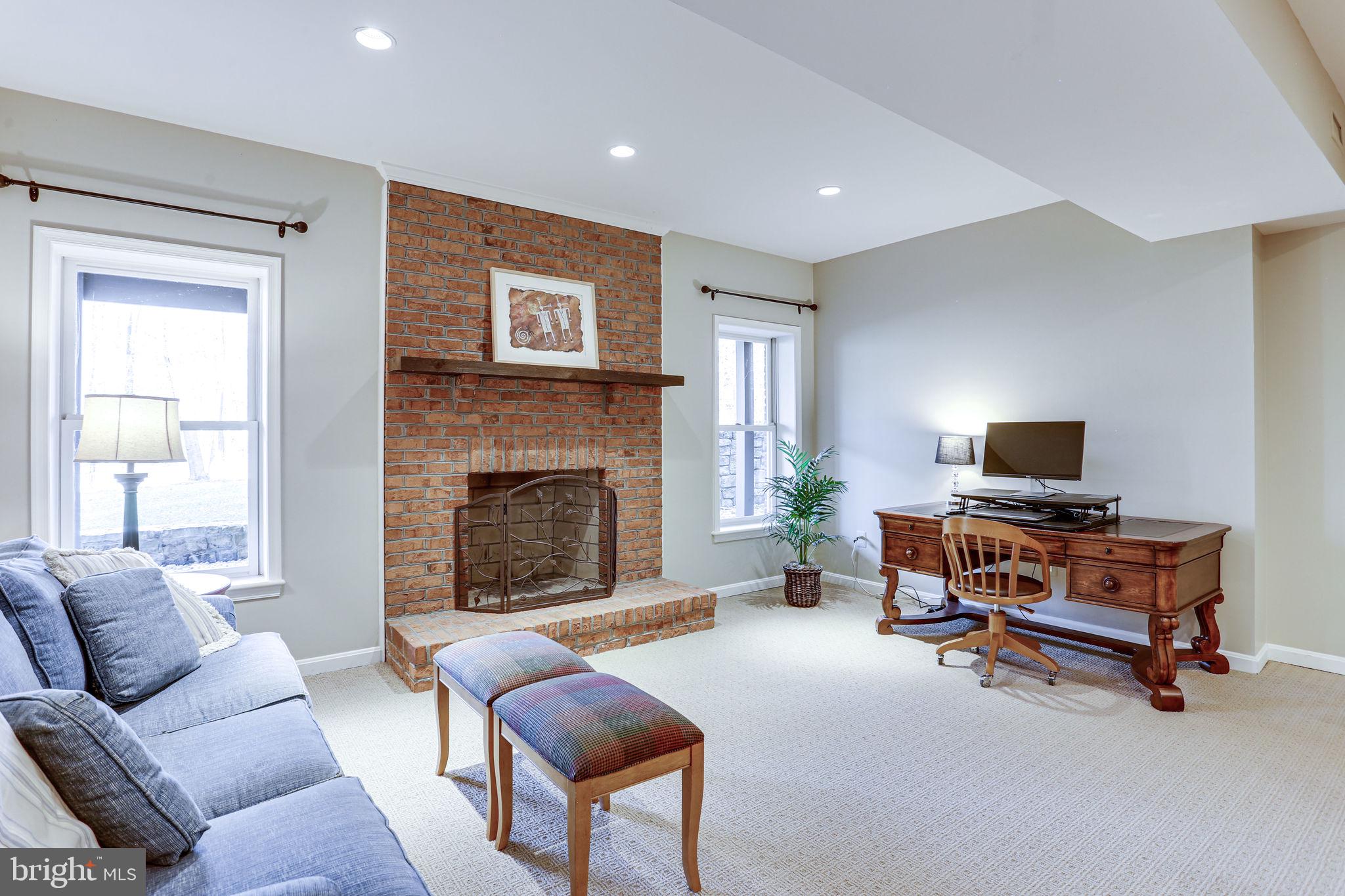 11622 Rolling Meadow Drive Great Falls, VA 22066 - Photo 31 of 45 Brick wood burning fireplace to take the chill out