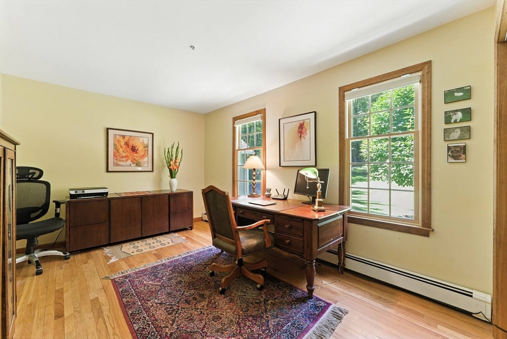 481 Kennedy Road Northampton, MA 01053 - Photo 17 of 40 a view of a workspace with furniture and a window