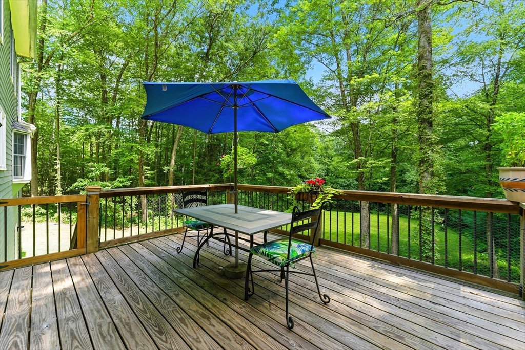 481 Kennedy Road Northampton, MA 01053 - Photo 19 of 40 a view of balcony with outdoor seating and wooden floor