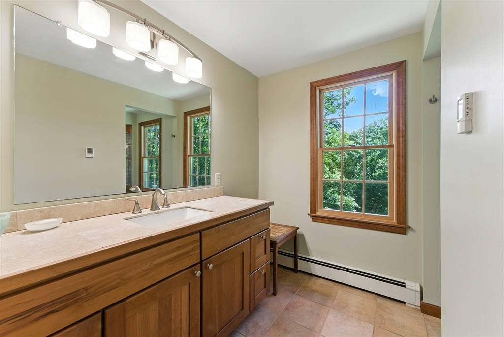 481 Kennedy Road Northampton, MA 01053 - Photo 24 of 40 a bathroom with a sink double vanity and a mirror