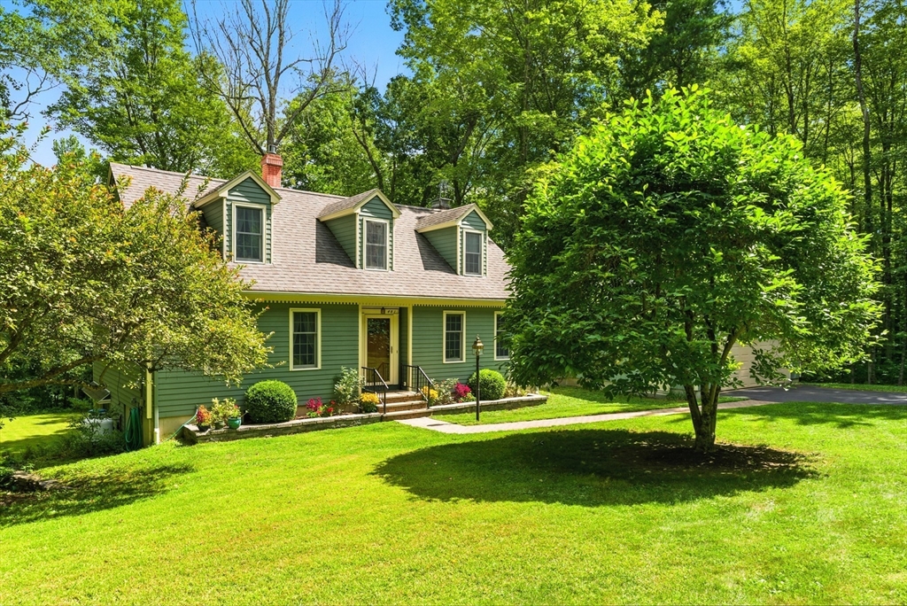 481 Kennedy Road Northampton, MA 01053 - Photo 34 of 40 a front view of a house with a yard and trees