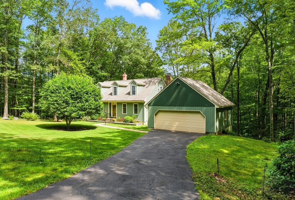 481 Kennedy Road Northampton, MA 01053 - Photo 35 of 40 a front view of a house with a yard and garage