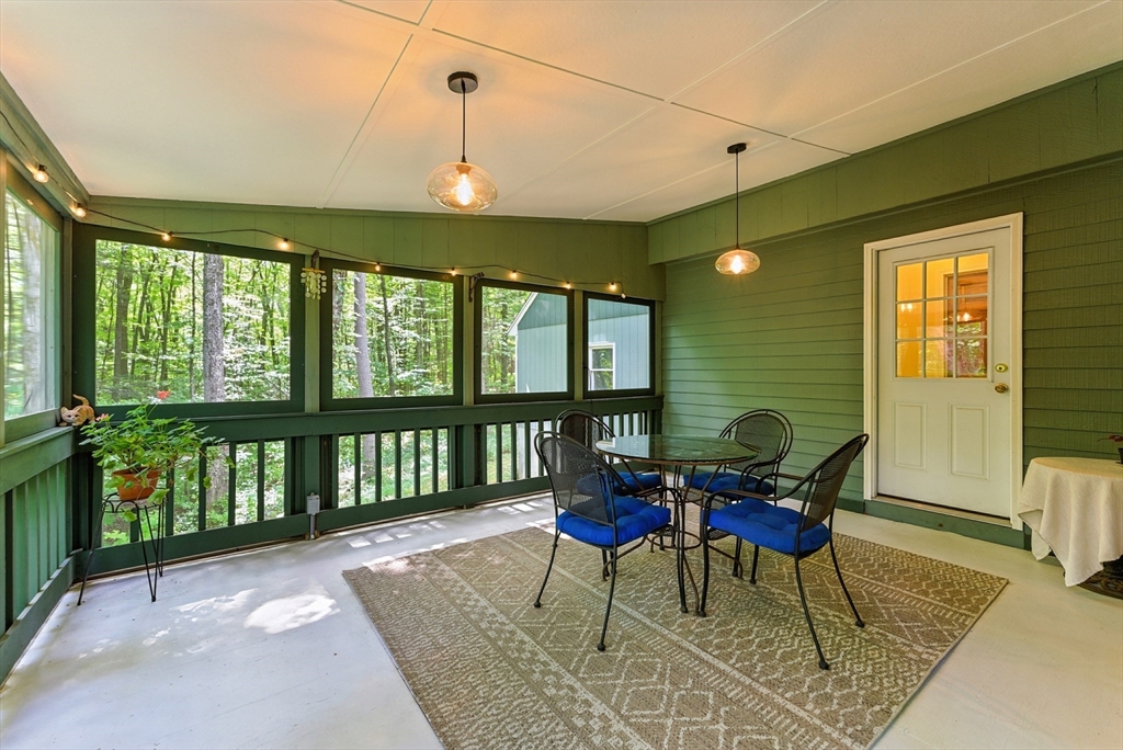 481 Kennedy Road Northampton, MA 01053 - Photo 4 of 40 a view of a dining room with furniture window and wooden floor