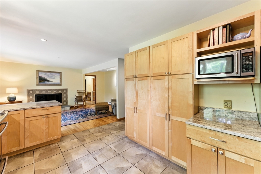 481 Kennedy Road Northampton, MA 01053 - Photo 9 of 40 a kitchen with stainless steel appliances granite countertop a refrigerator and a stove top oven