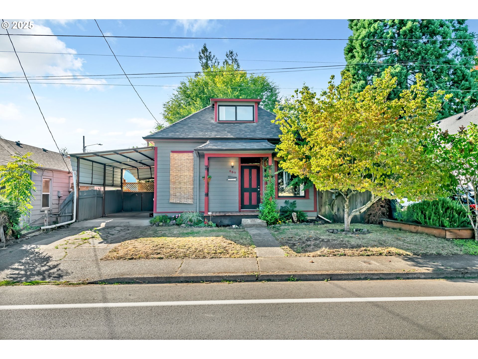 637 17th Street Northeast Salem, OR 97301 - Photo 1 of 34 a front view of a house with a yard and potted plants