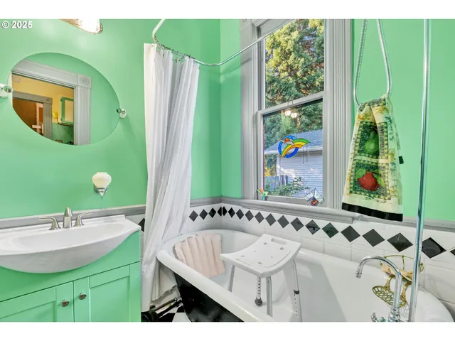 a bathroom with a sink a mirror and a window