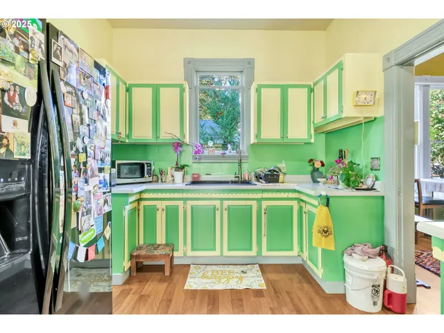 a living room with a fireplace furniture and a large window