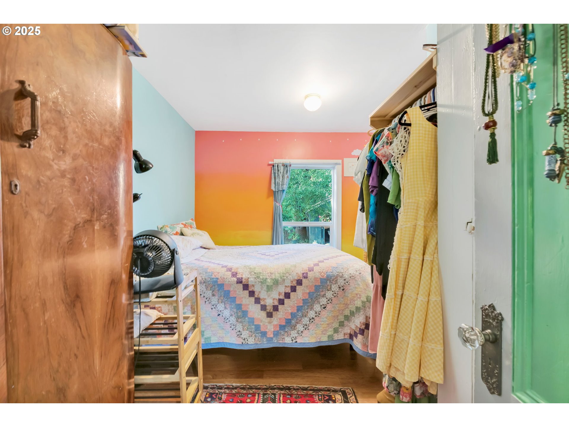 637 17th Street Northeast Salem, OR 97301 - Photo 20 of 34 a bed room with a bed and a painting on the wall