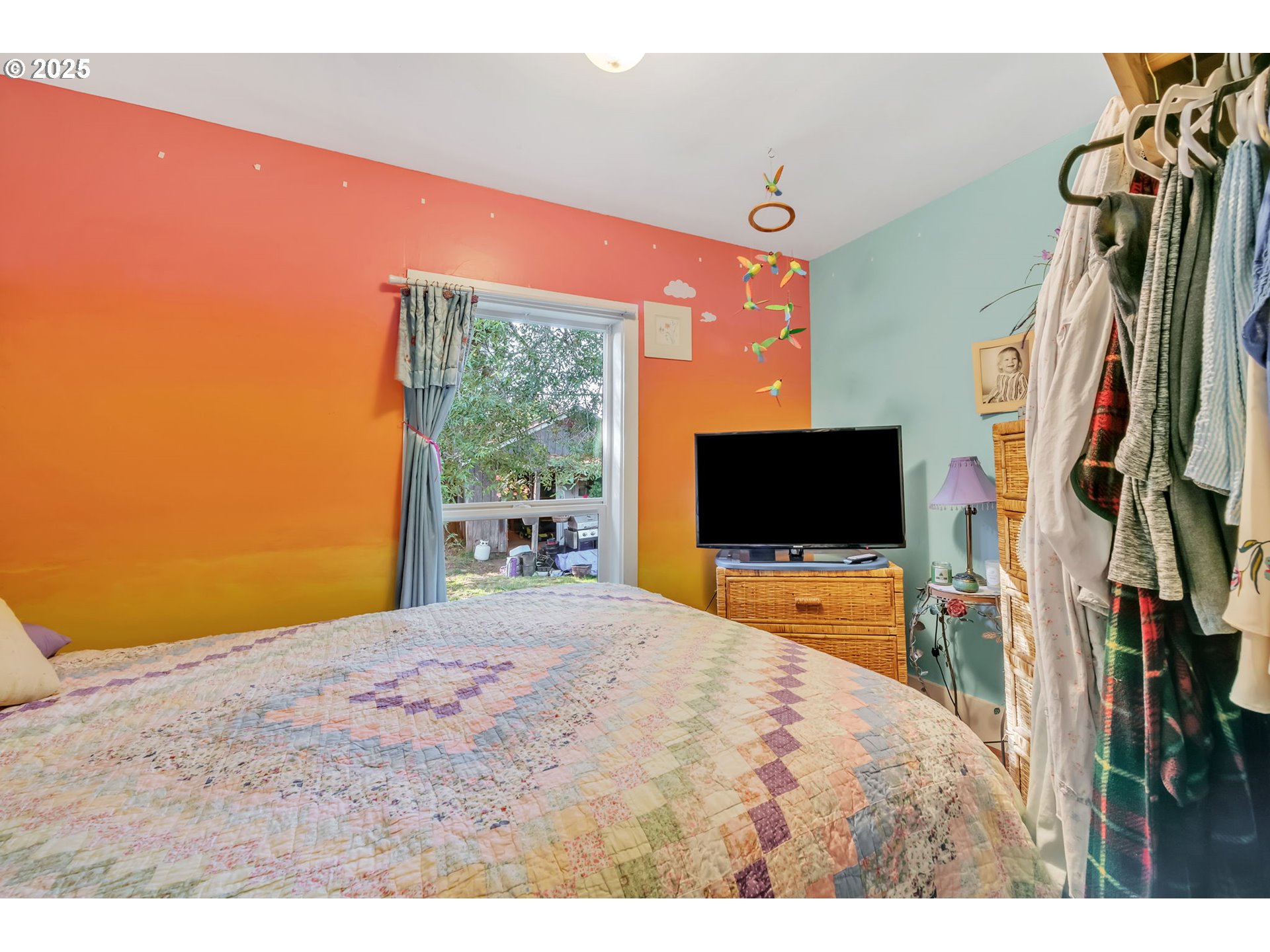 637 17th Street Northeast Salem, OR 97301 - Photo 21 of 34 a bedroom with a bed and a flat screen tv