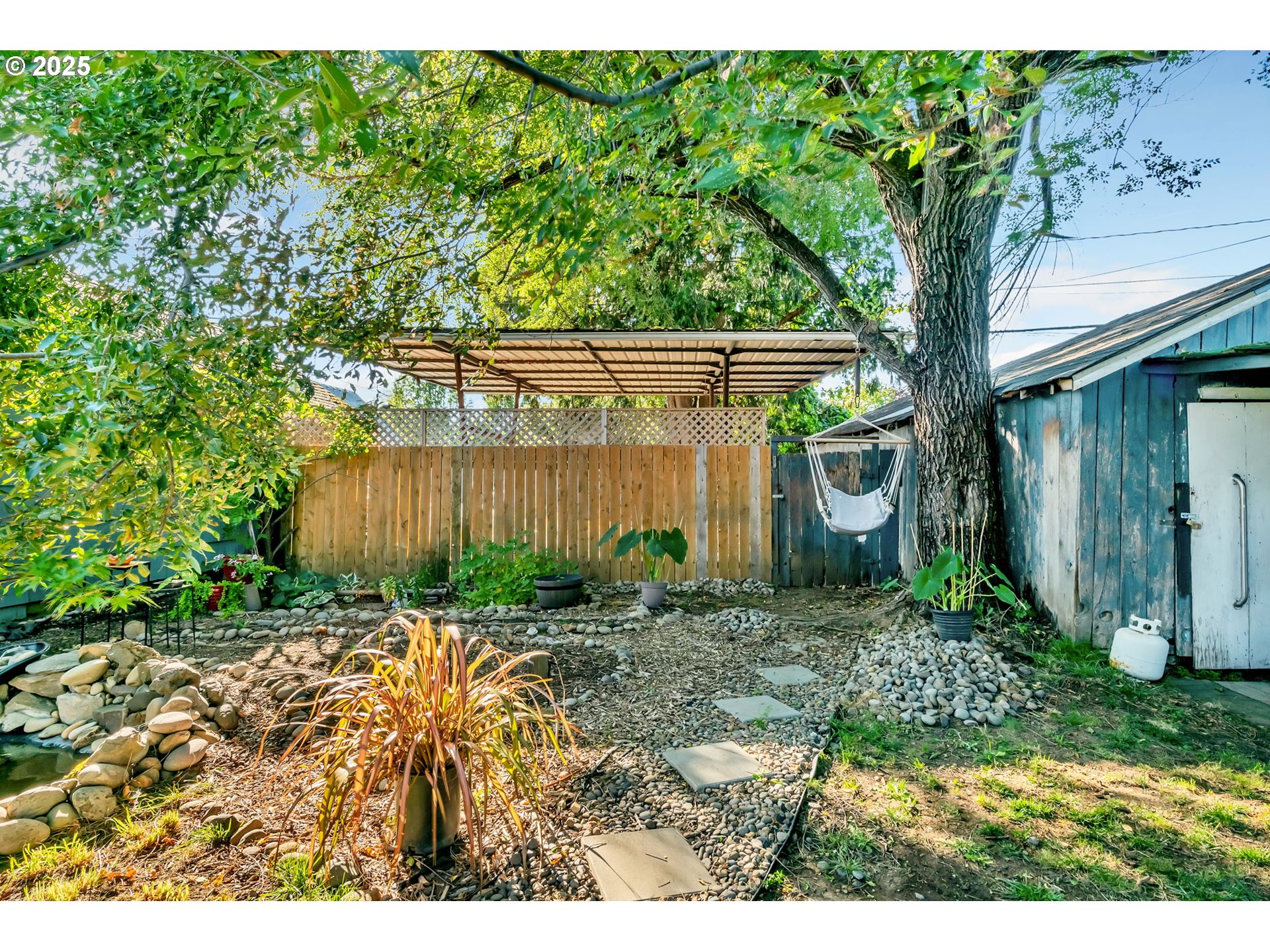 637 17th Street Northeast Salem, OR 97301 - Photo 26 of 34 a backyard of a house with lots of green space