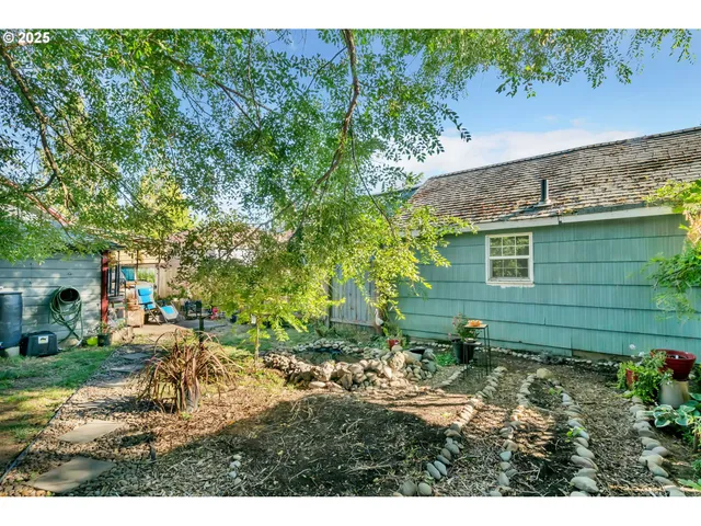 a view of backyard with outdoor seating and green space