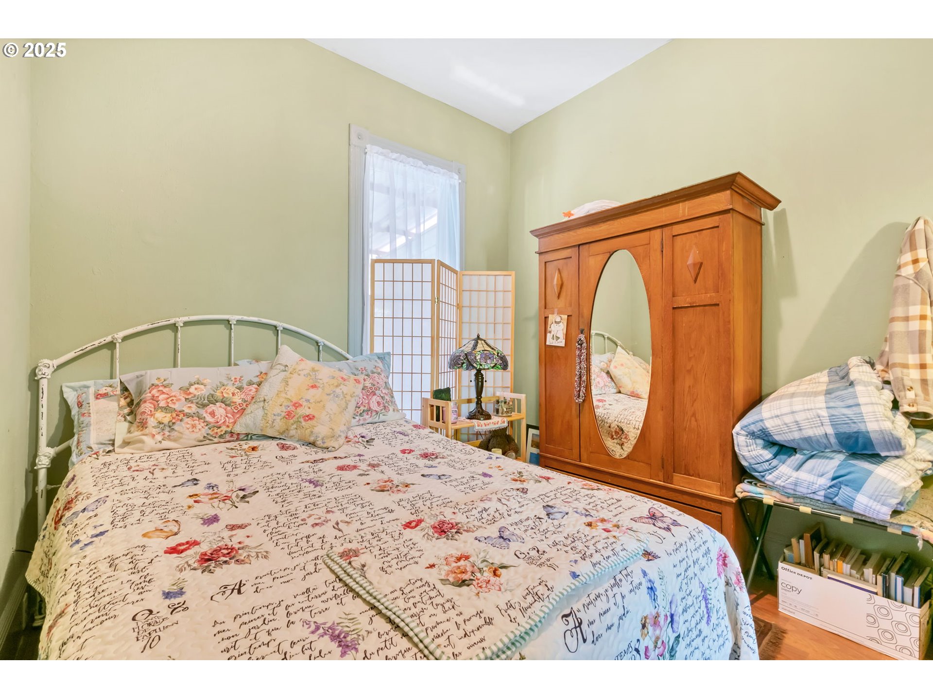 637 17th Street Northeast Salem, OR 97301 - Photo 10 of 34 a bedroom with a large bed and wooden floor