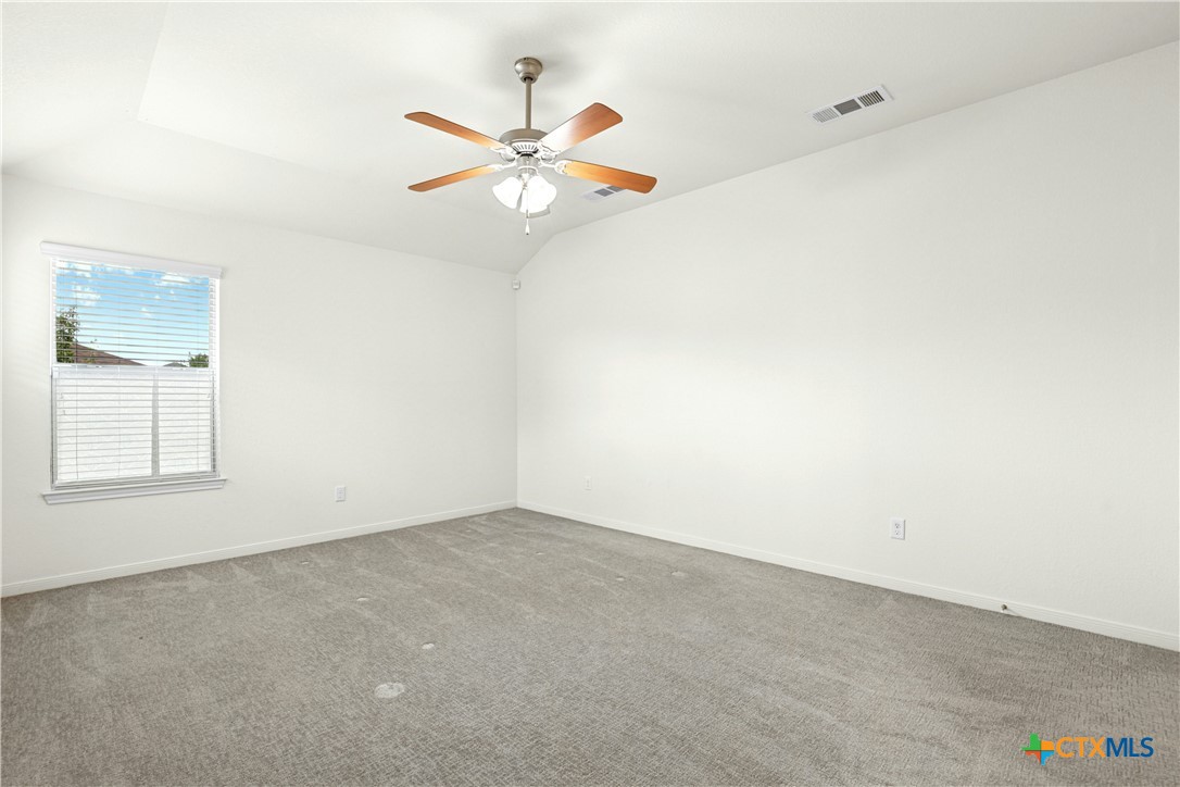 3203 Canadian River Loop Killeen, TX 76549 - Photo 16 of 27 an empty room with a window and a fan