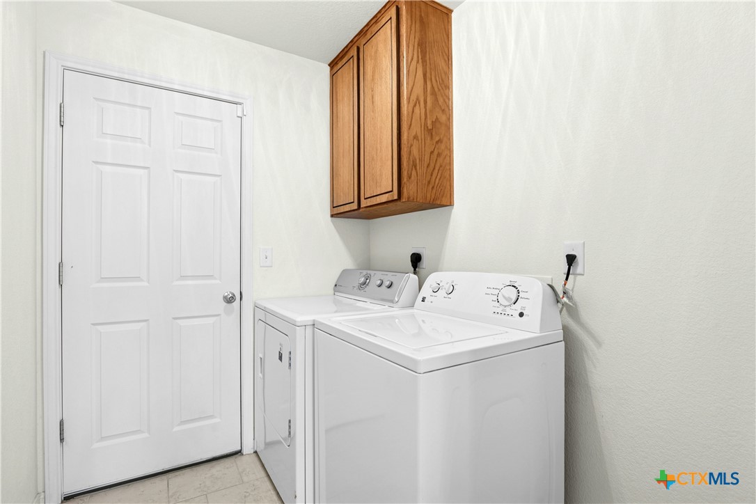 3203 Canadian River Loop Killeen, TX 76549 - Photo 20 of 27 a utility room with dryer and washer