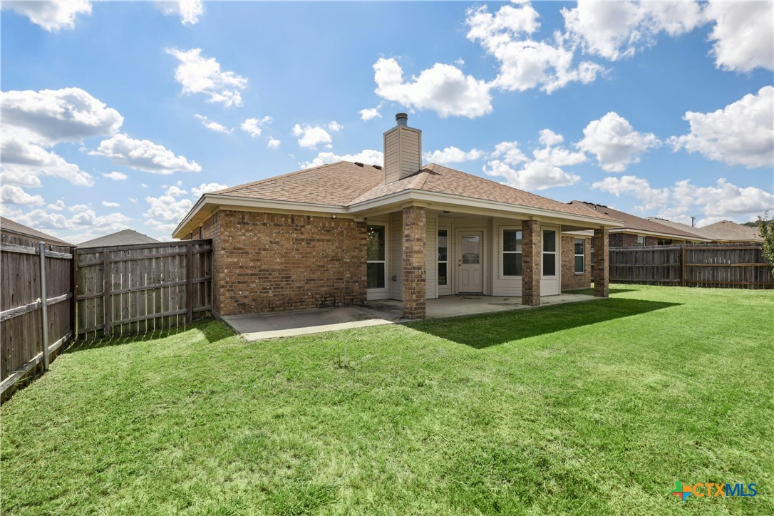 3203 Canadian River Loop Killeen, TX 76549 - Photo 25 of 27 a front view of a house with garden