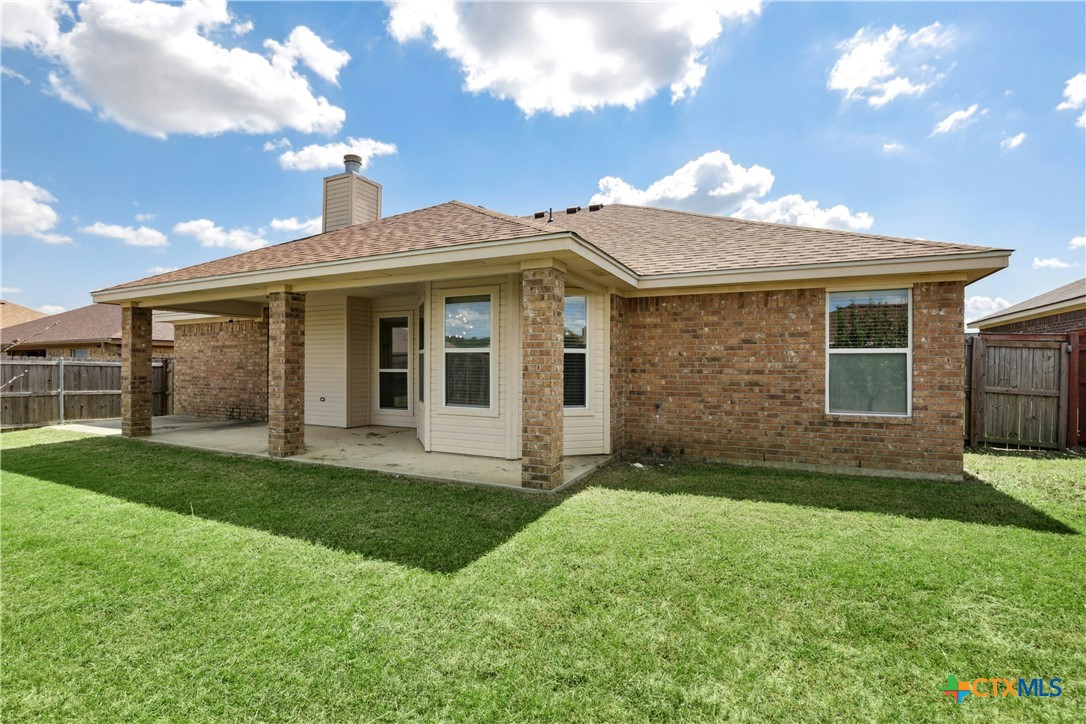 3203 Canadian River Loop Killeen, TX 76549 - Photo 26 of 27 a view of a yard in front of a house with large windows