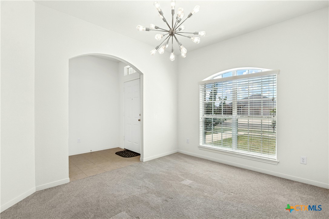 3203 Canadian River Loop Killeen, TX 76549 - Photo 5 of 27 an empty room with windows and fan