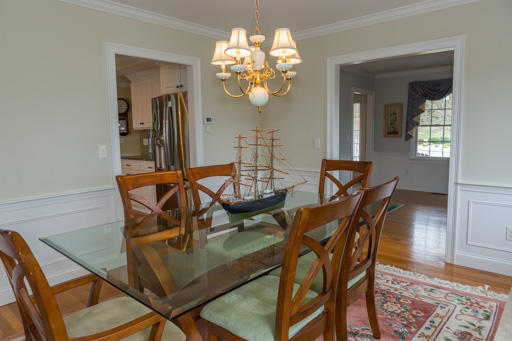 140 Great Marsh Road West Barnstable, MA 02668 - Photo 13 of 30 a view of a dining room with furniture and chandelier