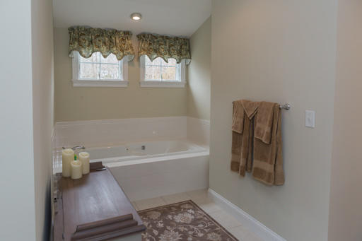 140 Great Marsh Road West Barnstable, MA 02668 - Photo 18 of 30 a bathroom with a bathtub and a window