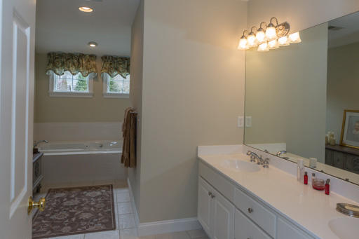 140 Great Marsh Road West Barnstable, MA 02668 - Photo 19 of 30 a bathroom with a sink tub and a mirror