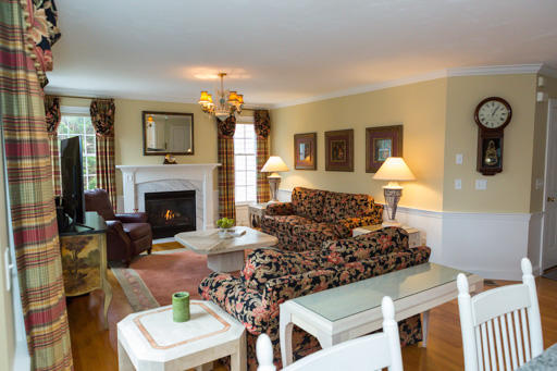 140 Great Marsh Road West Barnstable, MA 02668 - Photo 6 of 30 a living room with furniture a fireplace and a flat screen tv