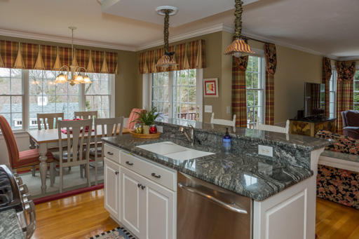 140 Great Marsh Road West Barnstable, MA 02668 - Photo 10 of 30 a kitchen with stainless steel appliances granite countertop a stove a sink and a granite counter tops with white cabinets