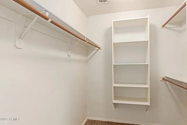 a view of an empty walk in closet