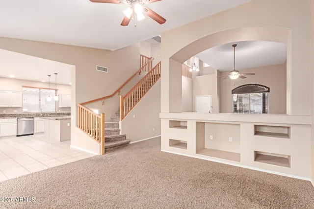 a view of staircase and kitchen view