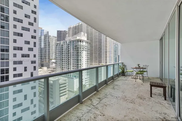 a view of a balcony with chairs