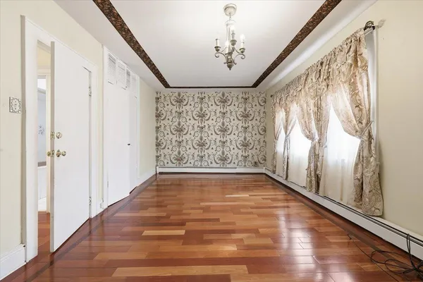 a view of entryway with wooden floor