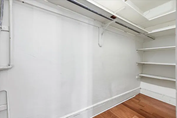 a view of livingroom with hardwood floor and a ceiling fan