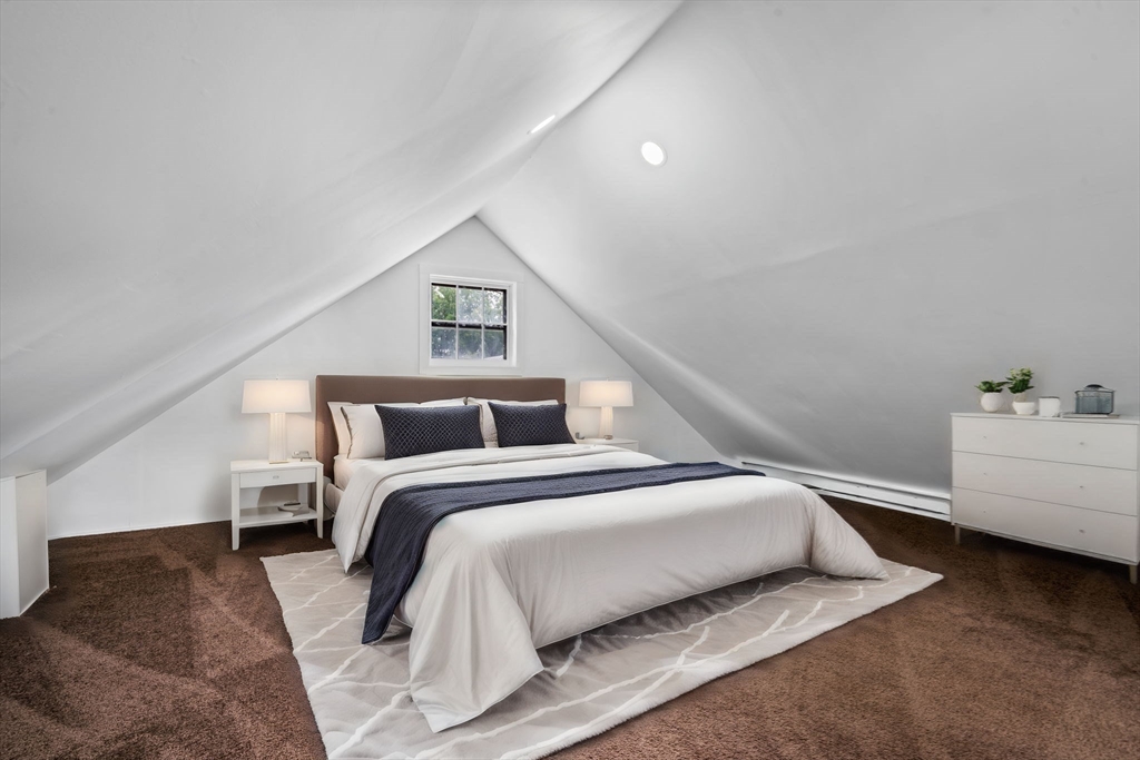 64 Pleasant Street Ware, MA 01082 - Photo 16 of 38 a bedroom with a bed and a couch