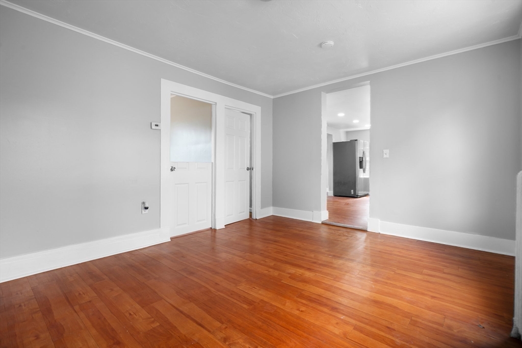 64 Pleasant Street Ware, MA 01082 - Photo 22 of 38 a view of empty room with wooden floor