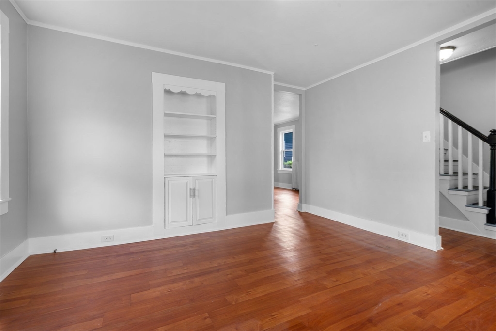 64 Pleasant Street Ware, MA 01082 - Photo 25 of 38 a view of an empty room with wooden floor and a window