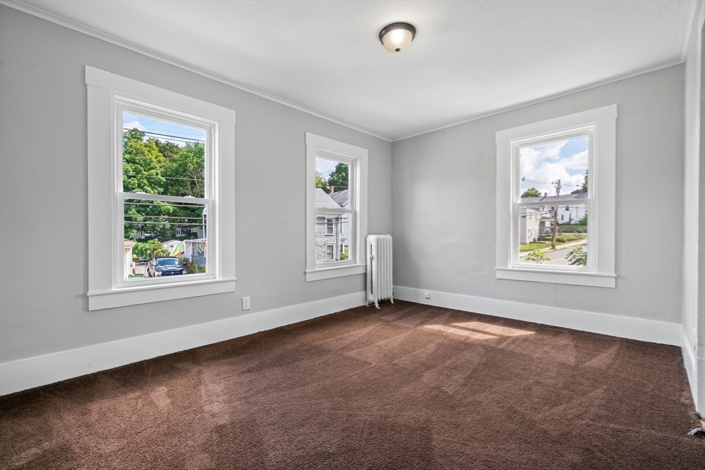 64 Pleasant Street Ware, MA 01082 - Photo 27 of 38 a view of an empty room with windows