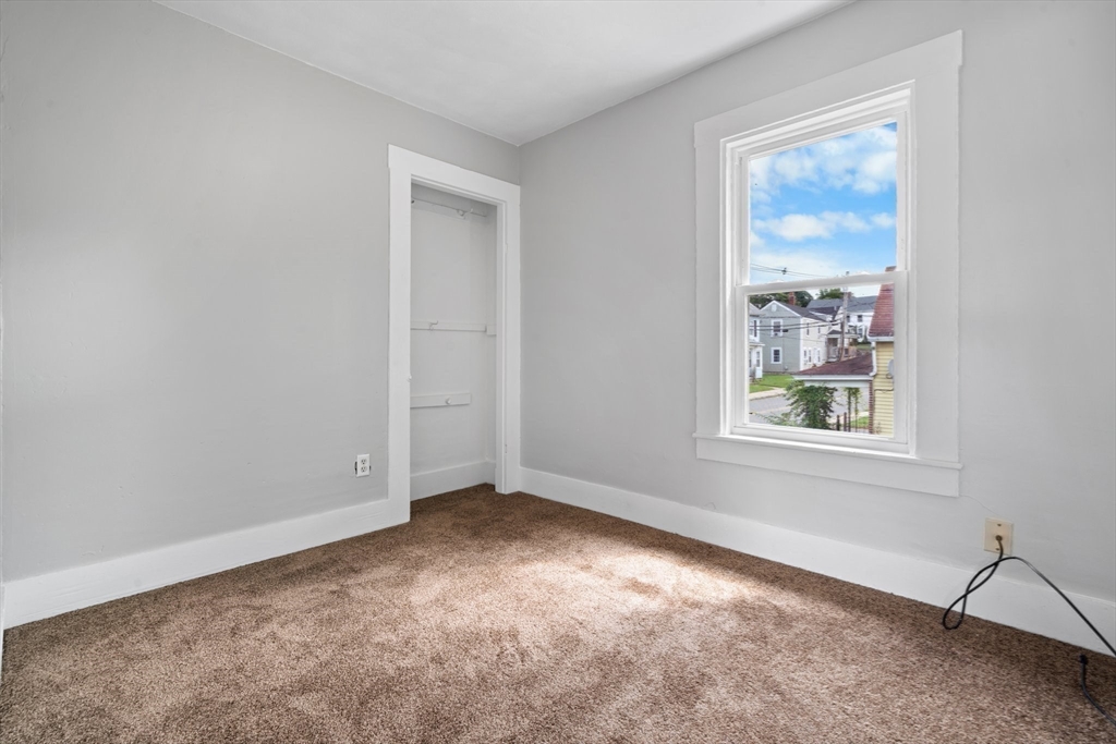 64 Pleasant Street Ware, MA 01082 - Photo 31 of 38 an empty room with windows