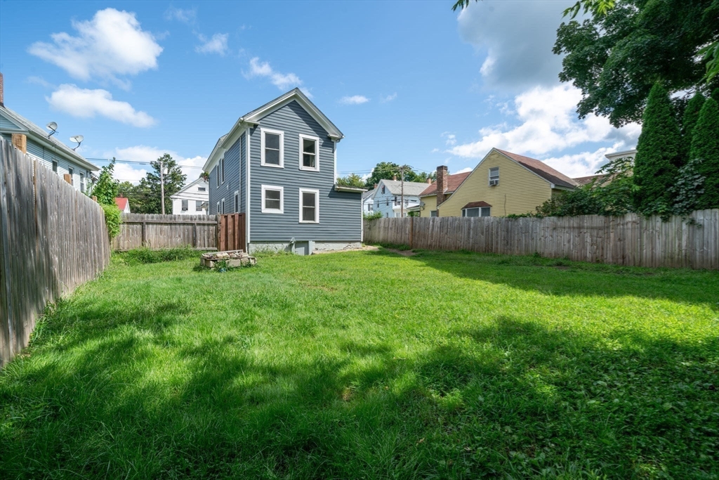 64 Pleasant Street Ware, MA 01082 - Photo 34 of 38 a front view of a house with a yard and green space