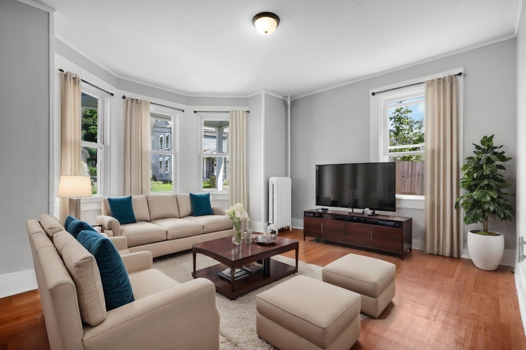 64 Pleasant Street Ware, MA 01082 - Photo 4 of 38 a living room with furniture and a flat screen tv