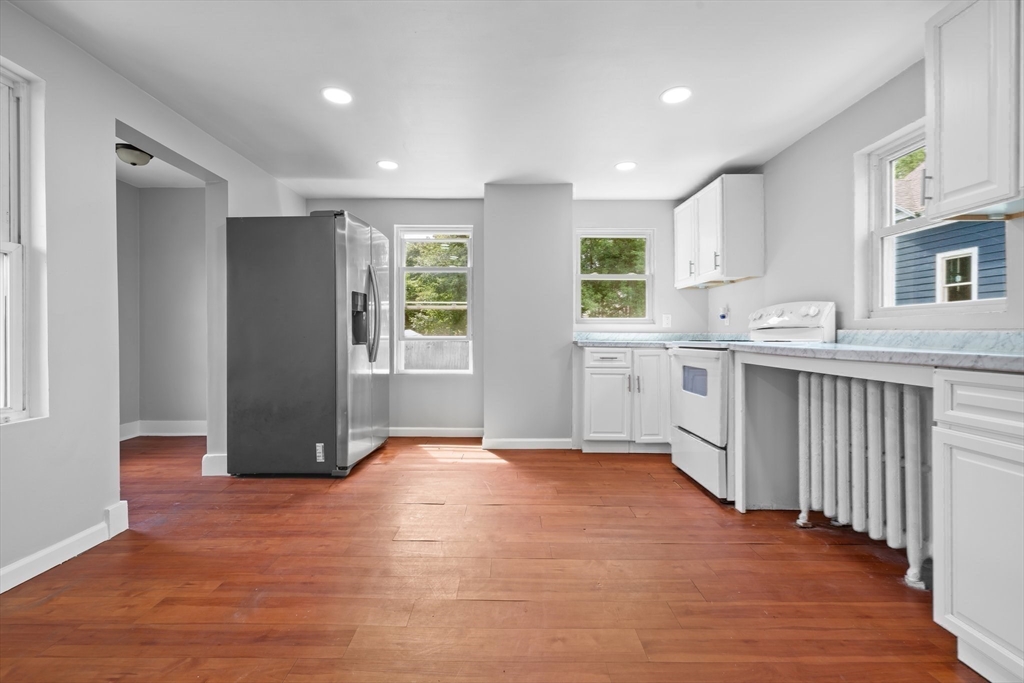 64 Pleasant Street Ware, MA 01082 - Photo 10 of 38 a view of a kitchen with a sink and a window