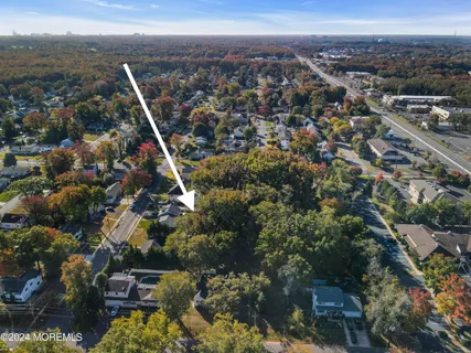 an aerial view of a house with a mountain view