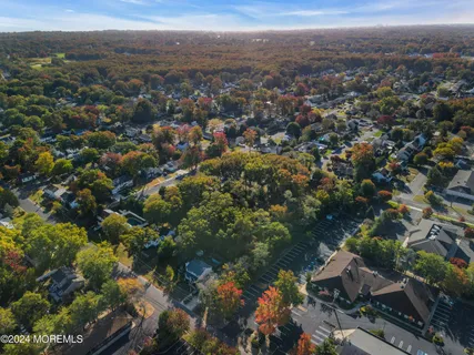 an aerial view of a house with a mountain view