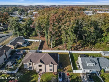 an aerial view of a house with a mountain view