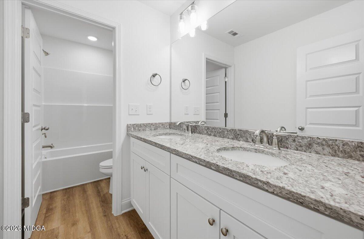 2762 Boxankle Road Forsyth, GA 31029 - Photo 15 of 19 a bathroom with a granite countertop sink mirror and a bathtub
