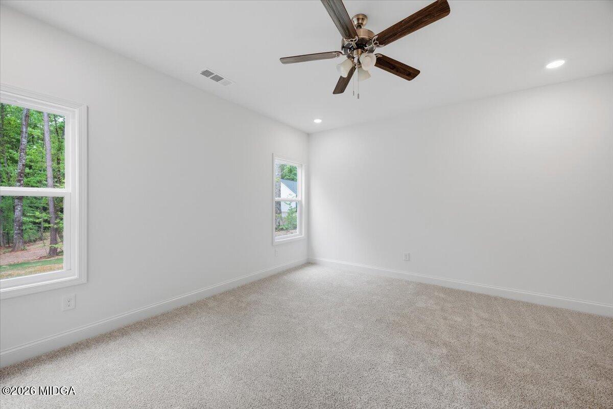 2762 Boxankle Road Forsyth, GA 31029 - Photo 7 of 19 an empty room with a window and a fan