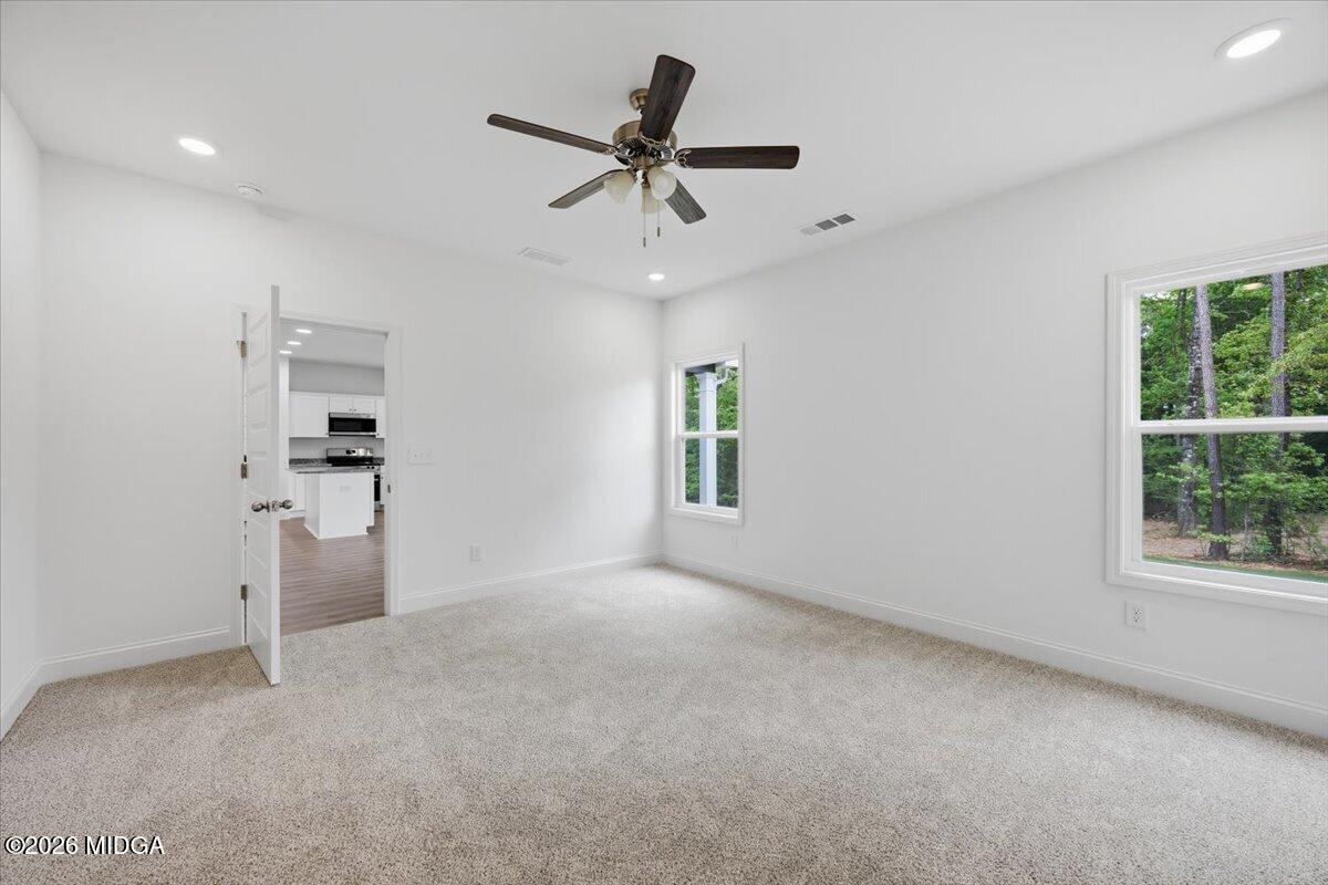2762 Boxankle Road Forsyth, GA 31029 - Photo 8 of 19 an empty room with closet and windows