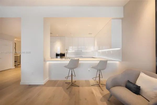 a spacious bedroom with a bed and a window