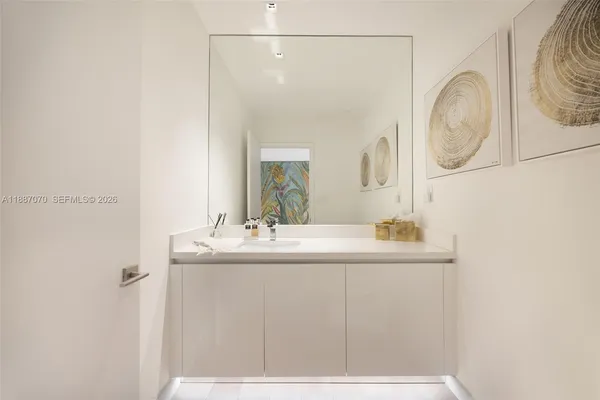 a room with a table and mirror