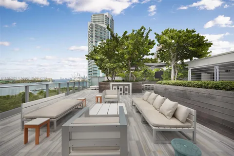 a view of balcony with furniture