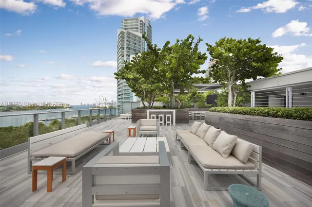 a view of balcony with furniture